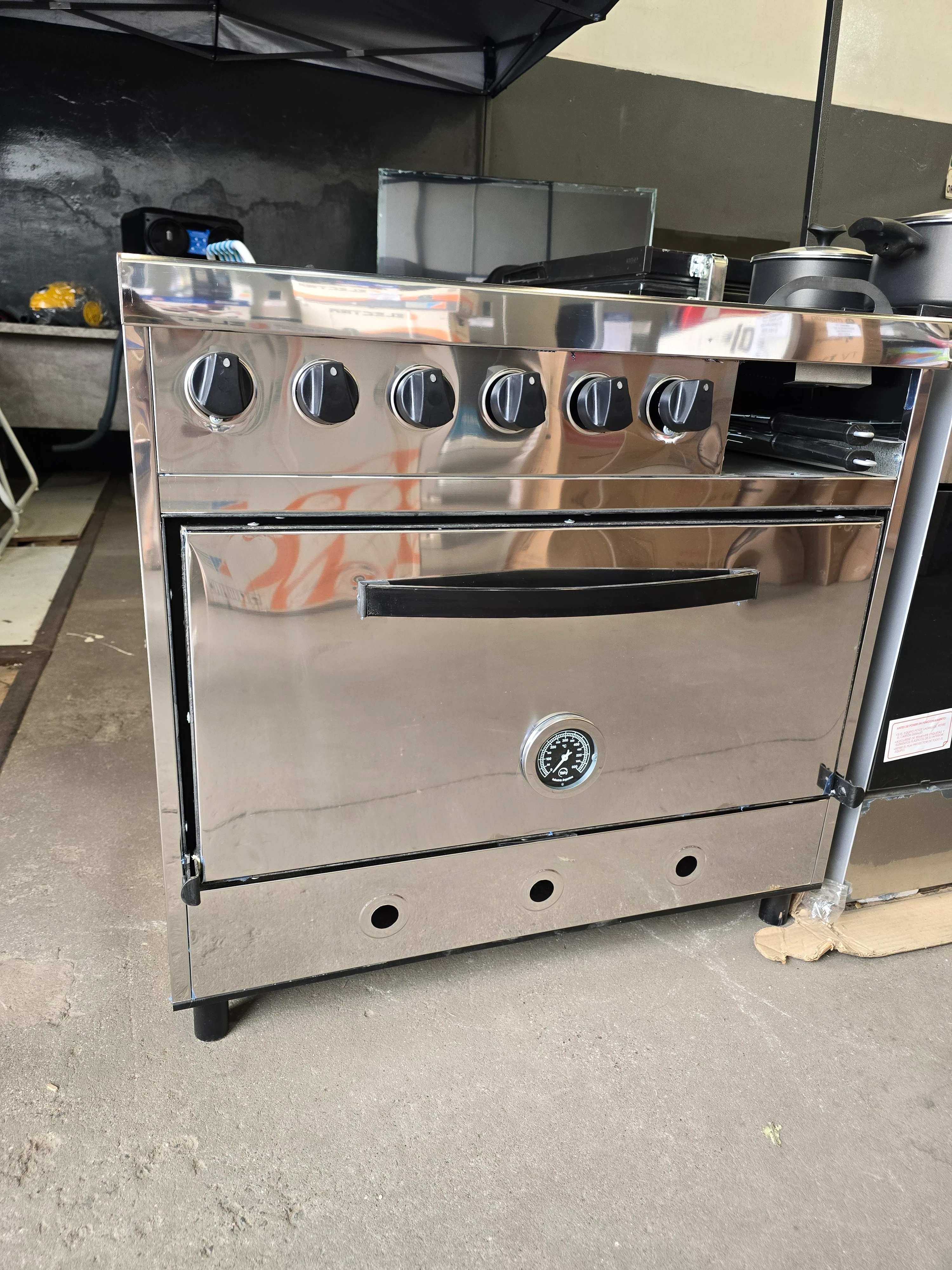 COCINA DELU 4 HORNALLAS C/PLANCHETA Y CARLITERO 86CM GAS ENVASADO 3
