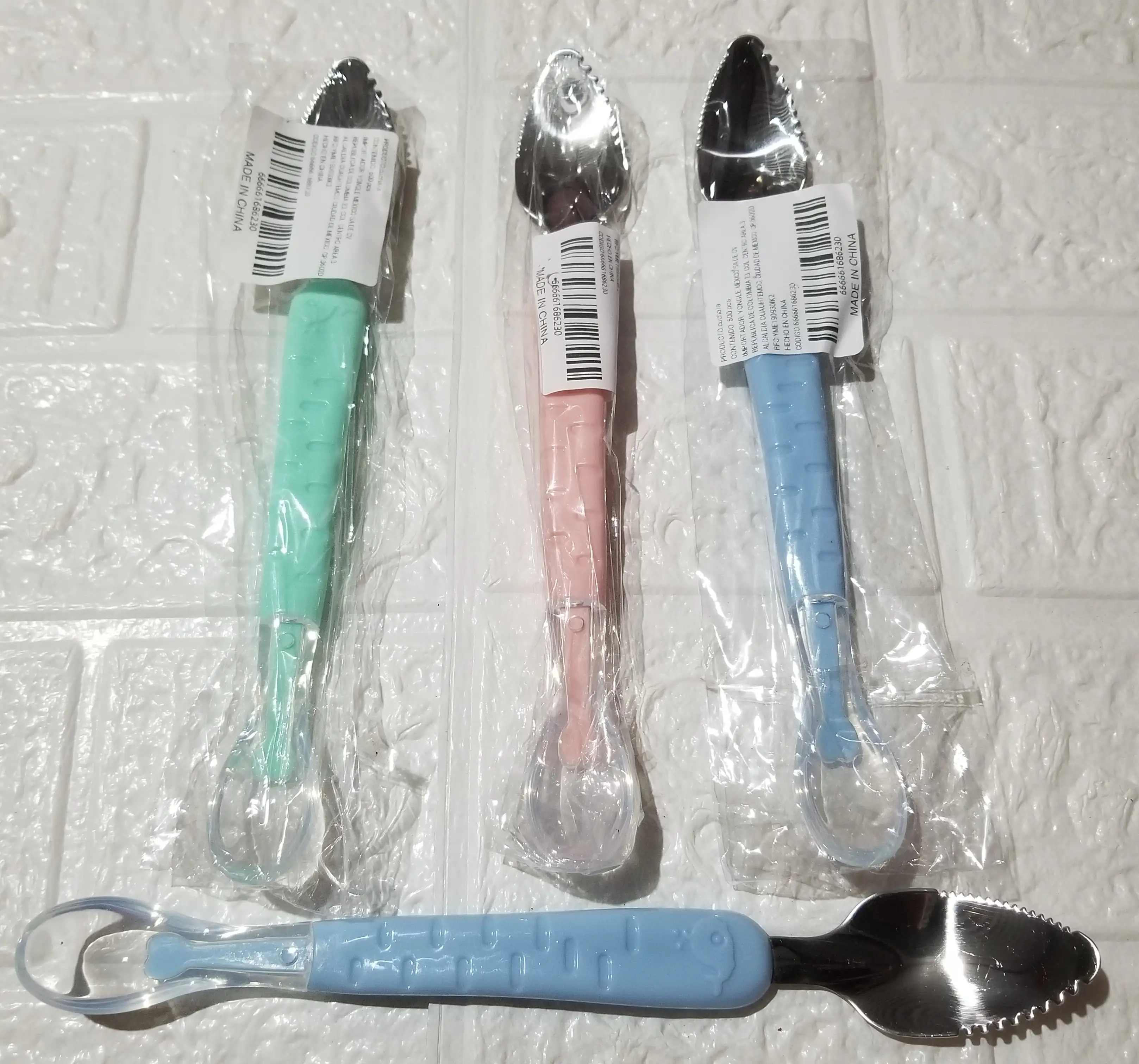 Cuchara doble para raspar la fruta