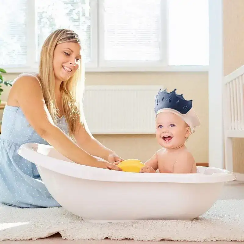 GORRO DE BAÑO AJUSTABLE PROTECCION DE OIDOS LAVA CABEZAS NIÑOS