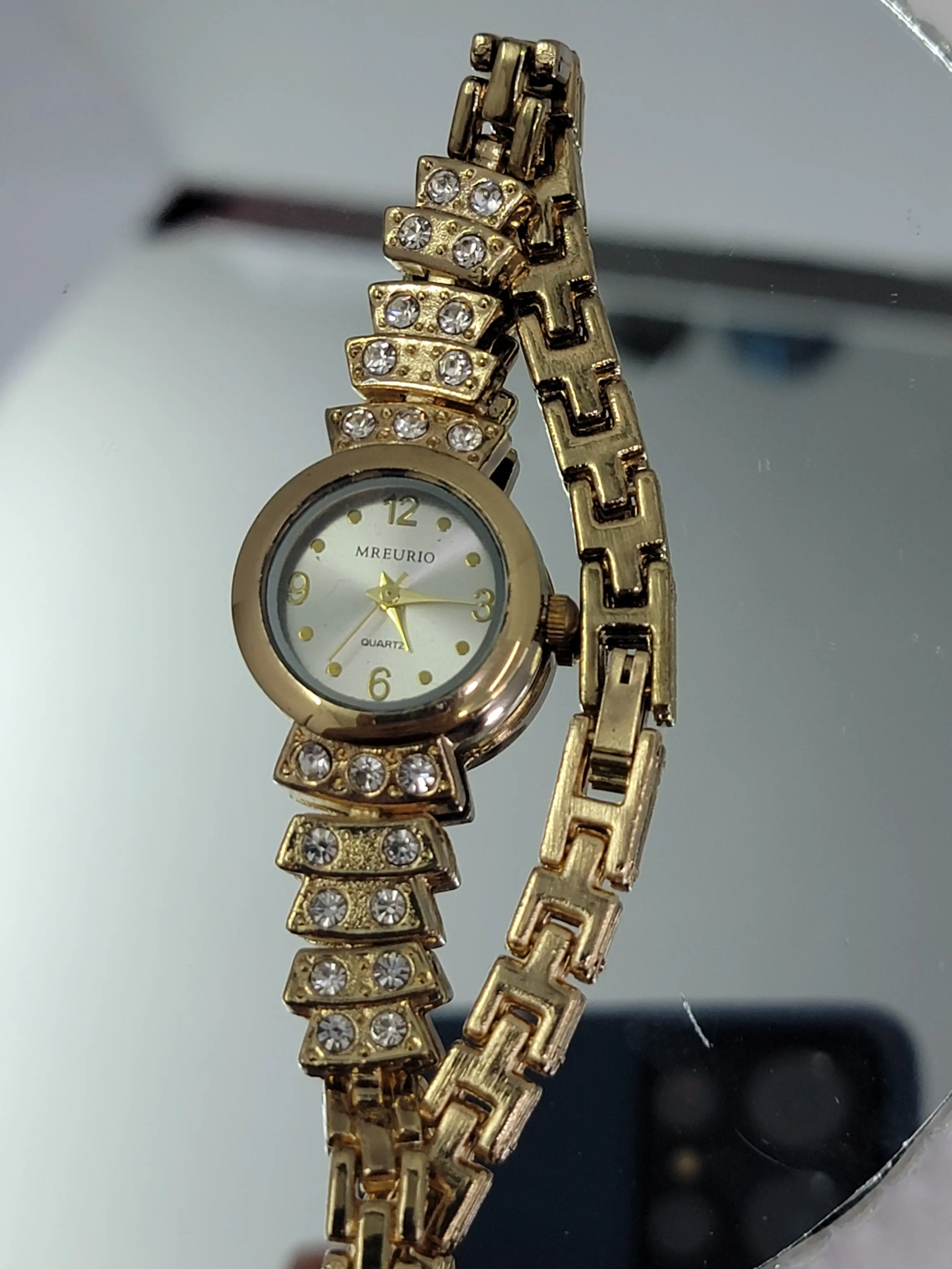 Reloj acerado dorado 4