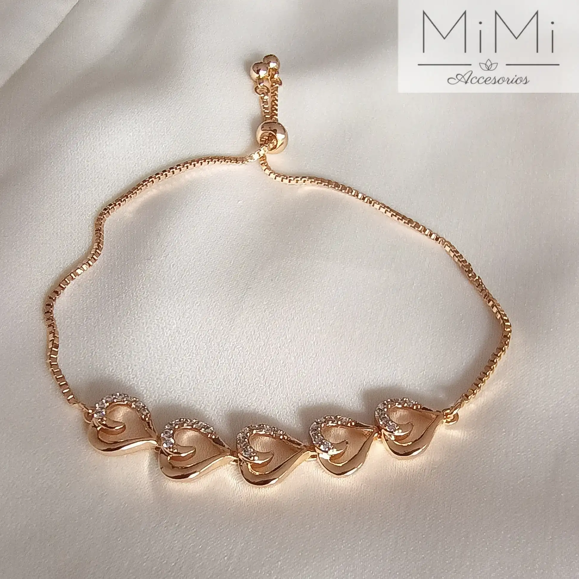 Pulsera bañada en oro corazones entrelazados