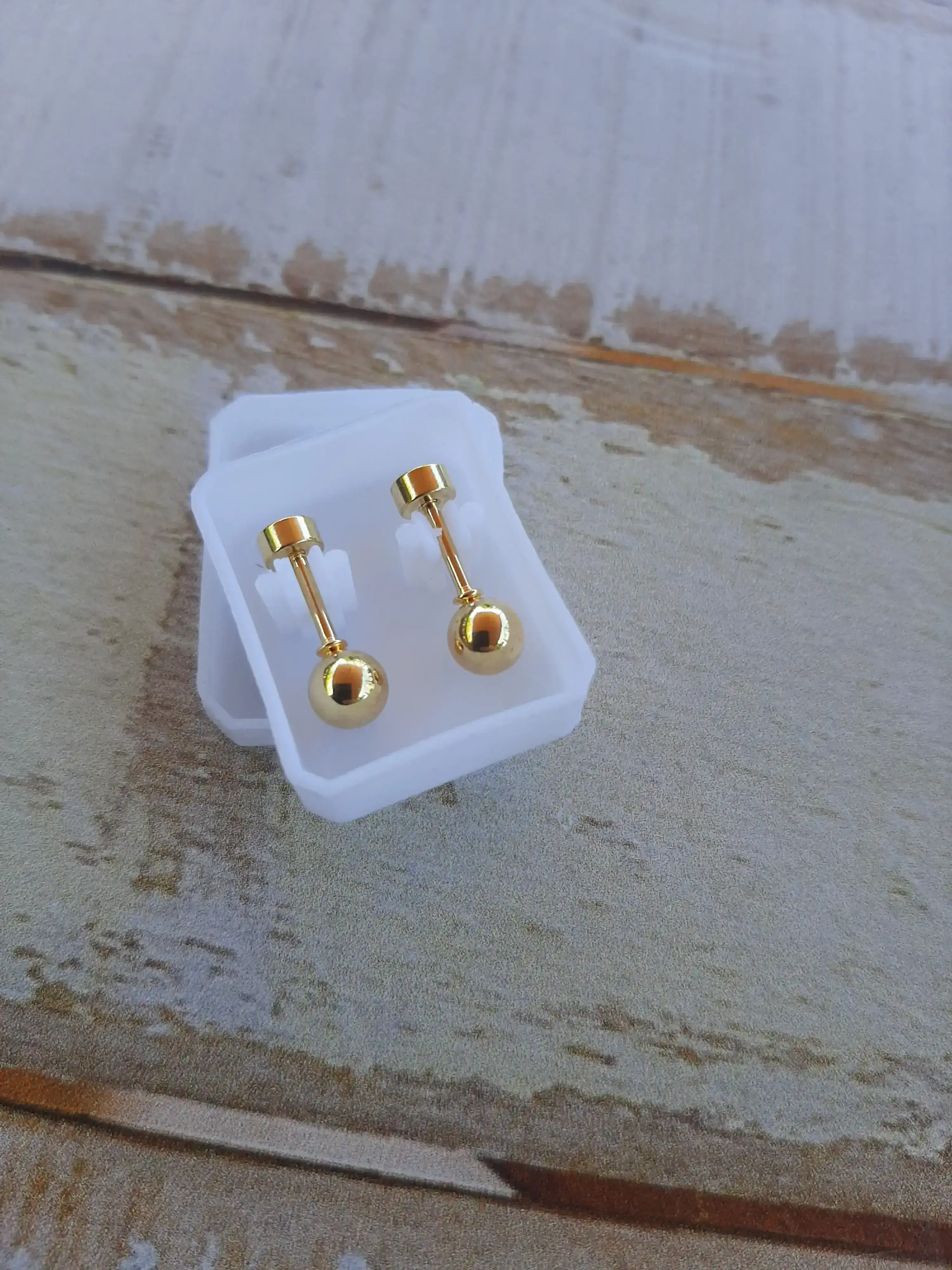 Abridor acero dorado