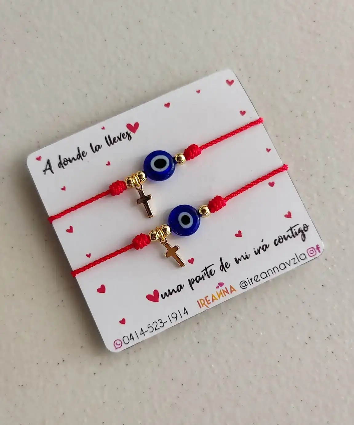 Par pulseras ojo turco y cruz  2