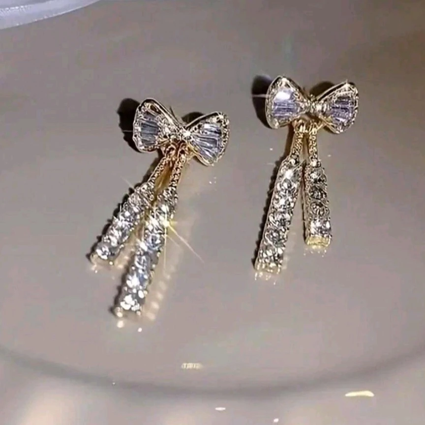 Aretes colgantes moño  2