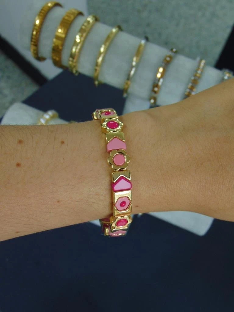 PULSERA ACERO DORADA ELASTICA DIJES FLORES ROSA