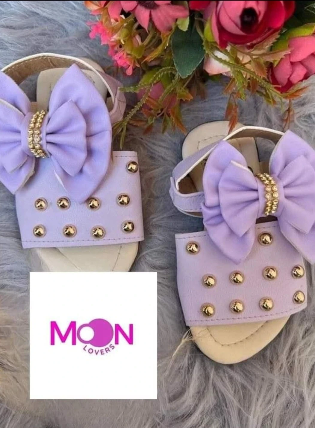 Mod.876 Sandalia niña Lila moño estoperoles 