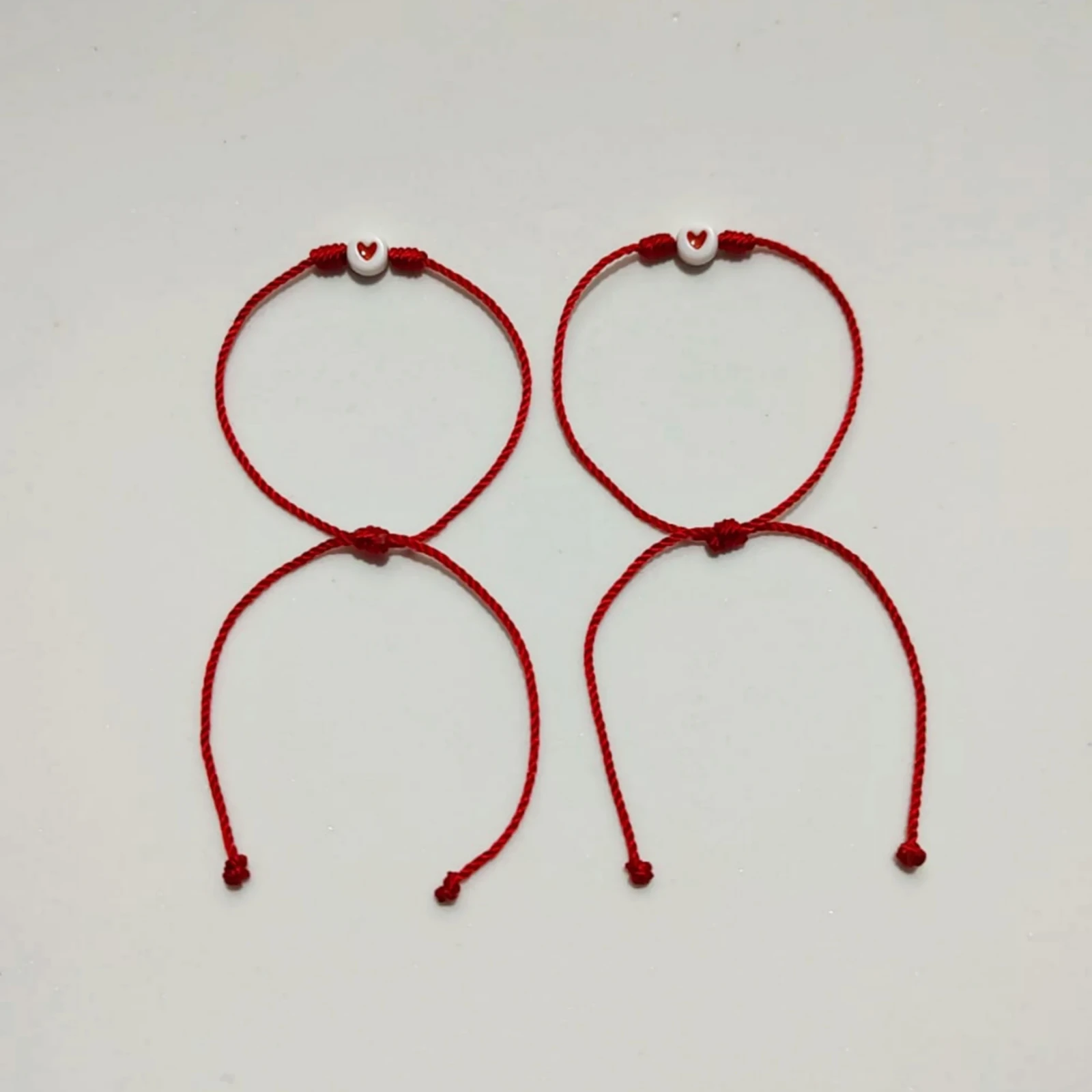 Dúo Pulseras Rojas con Corazón 2
