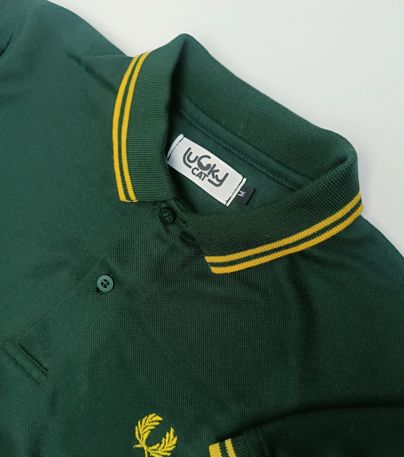 Camisa polo verde botella con amarillo 