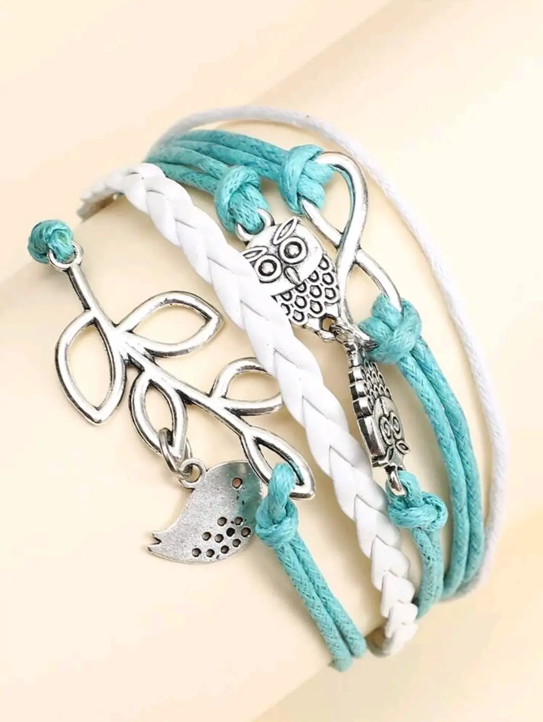 Pulsera turqueza con buhos e infinito