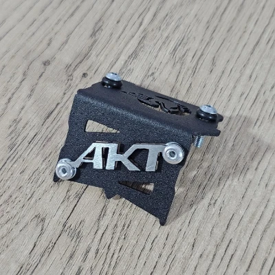 AKT / NKD / RTX / TT / TTR / P. freno delantero acero negro logo 3d cromado ML