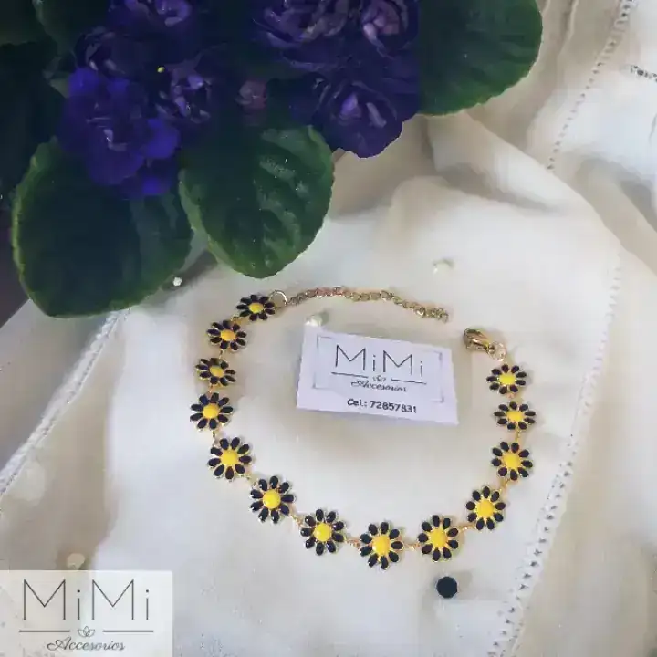 Manilla con flores negras en acero inoxidable 