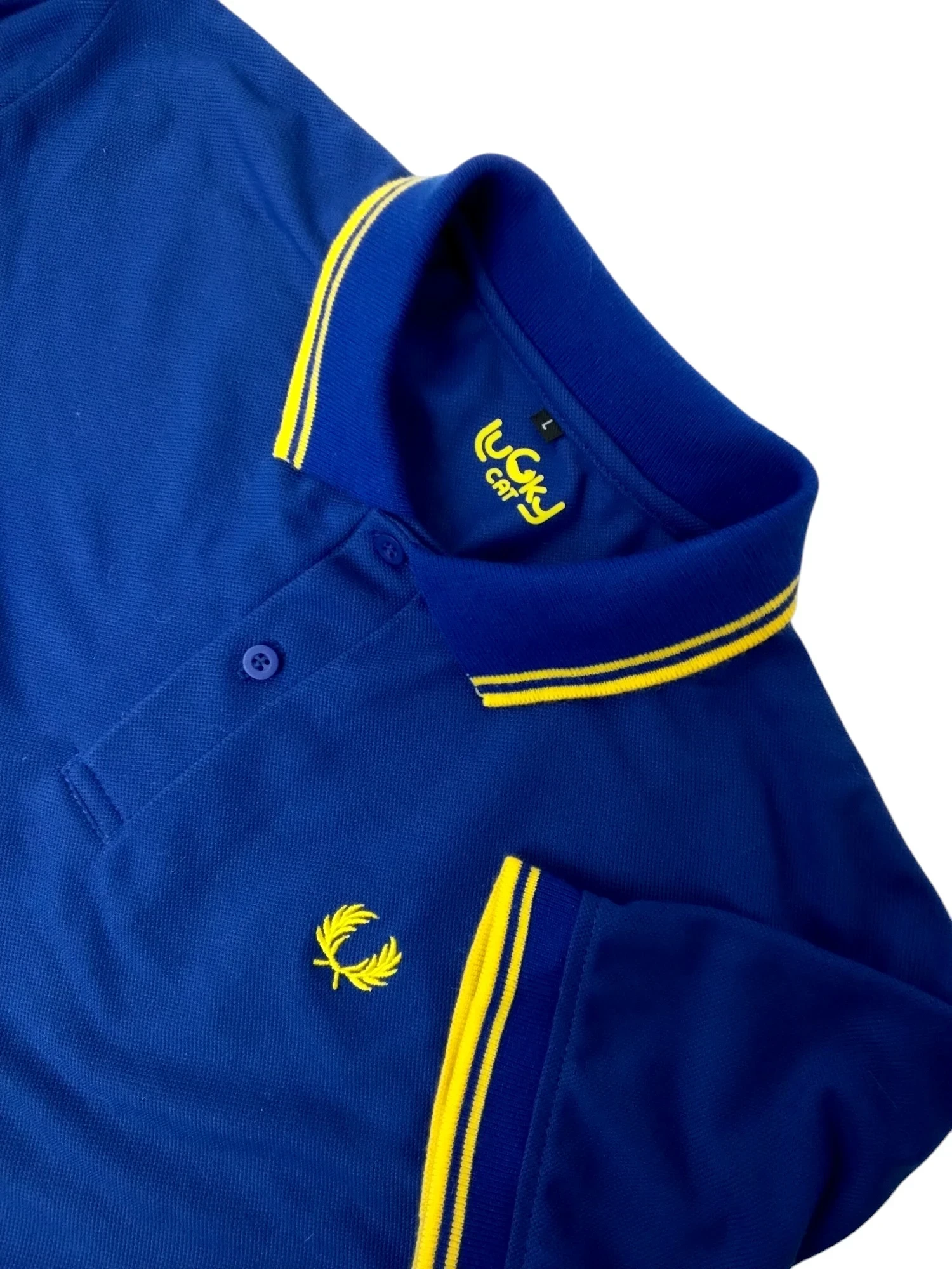Camisa polo azul rey con amarillo 