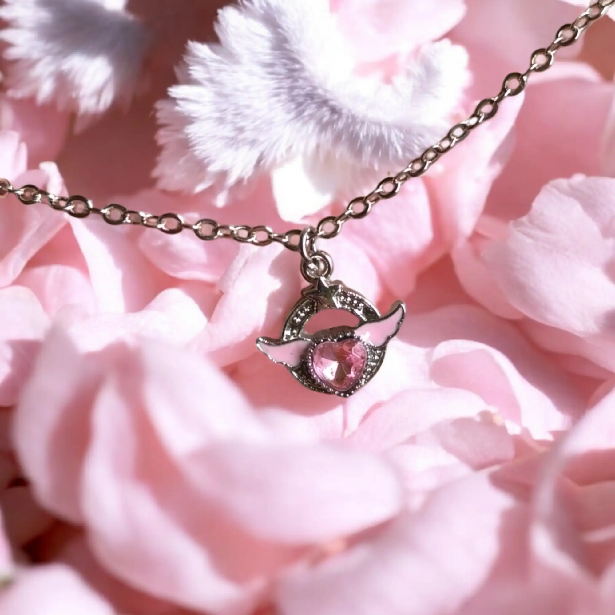 Corazón alado rosa 