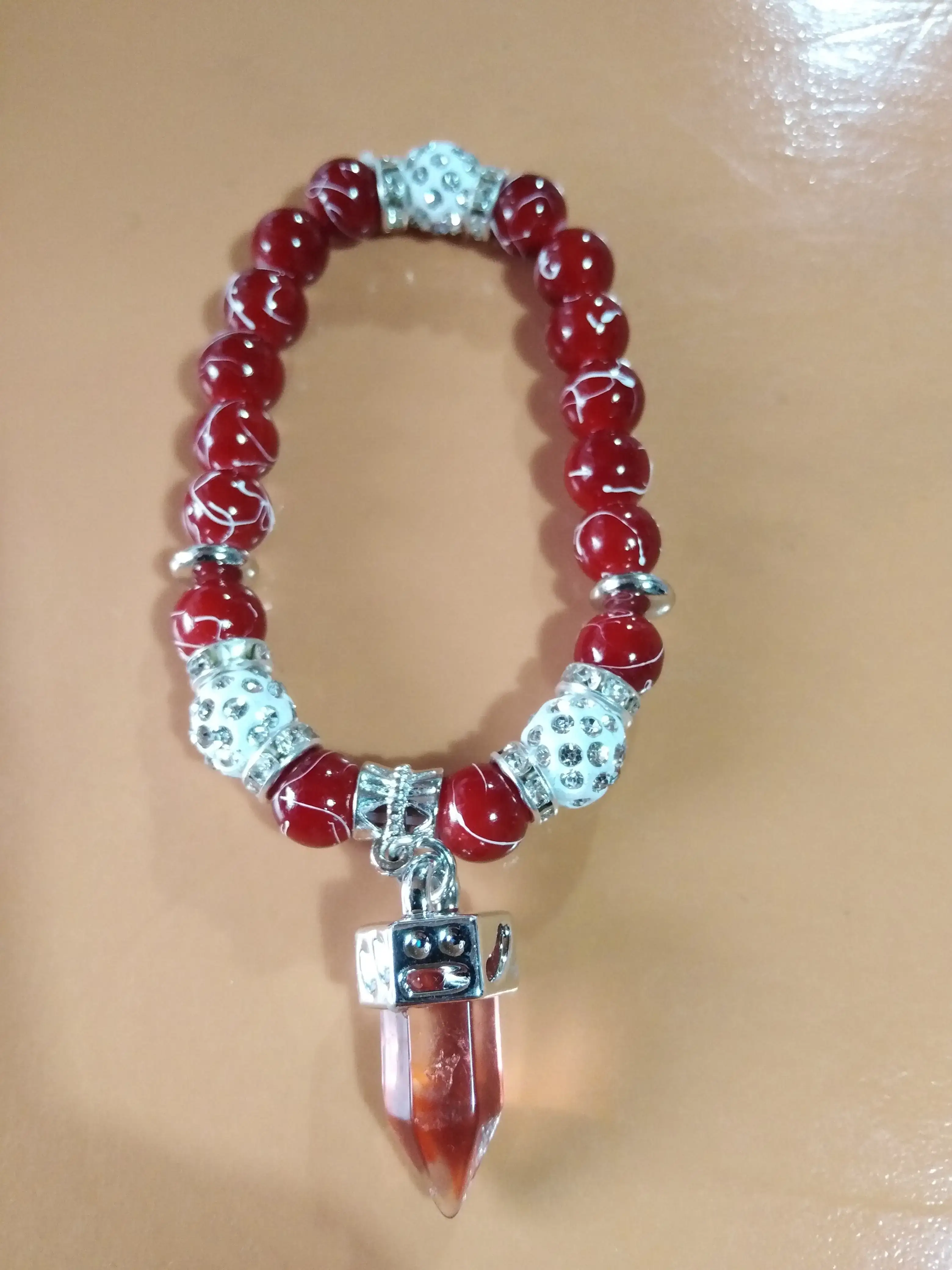 Pulsera roja péndulo 