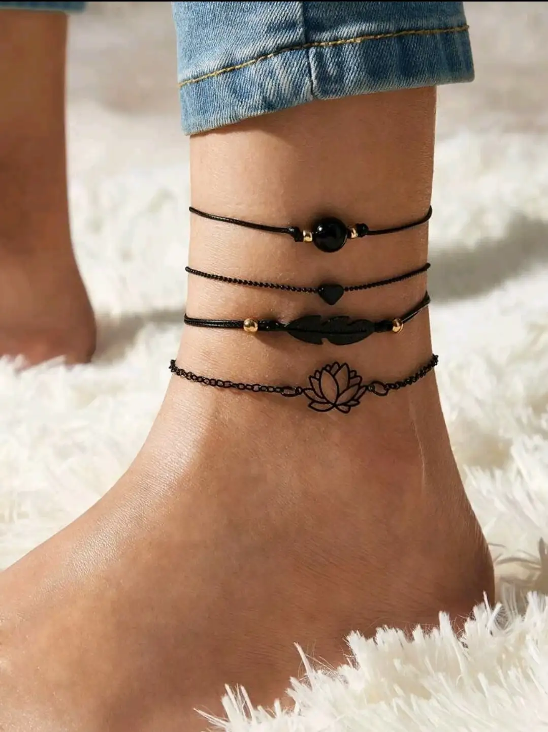 Juego de anklets negros con flor de loto