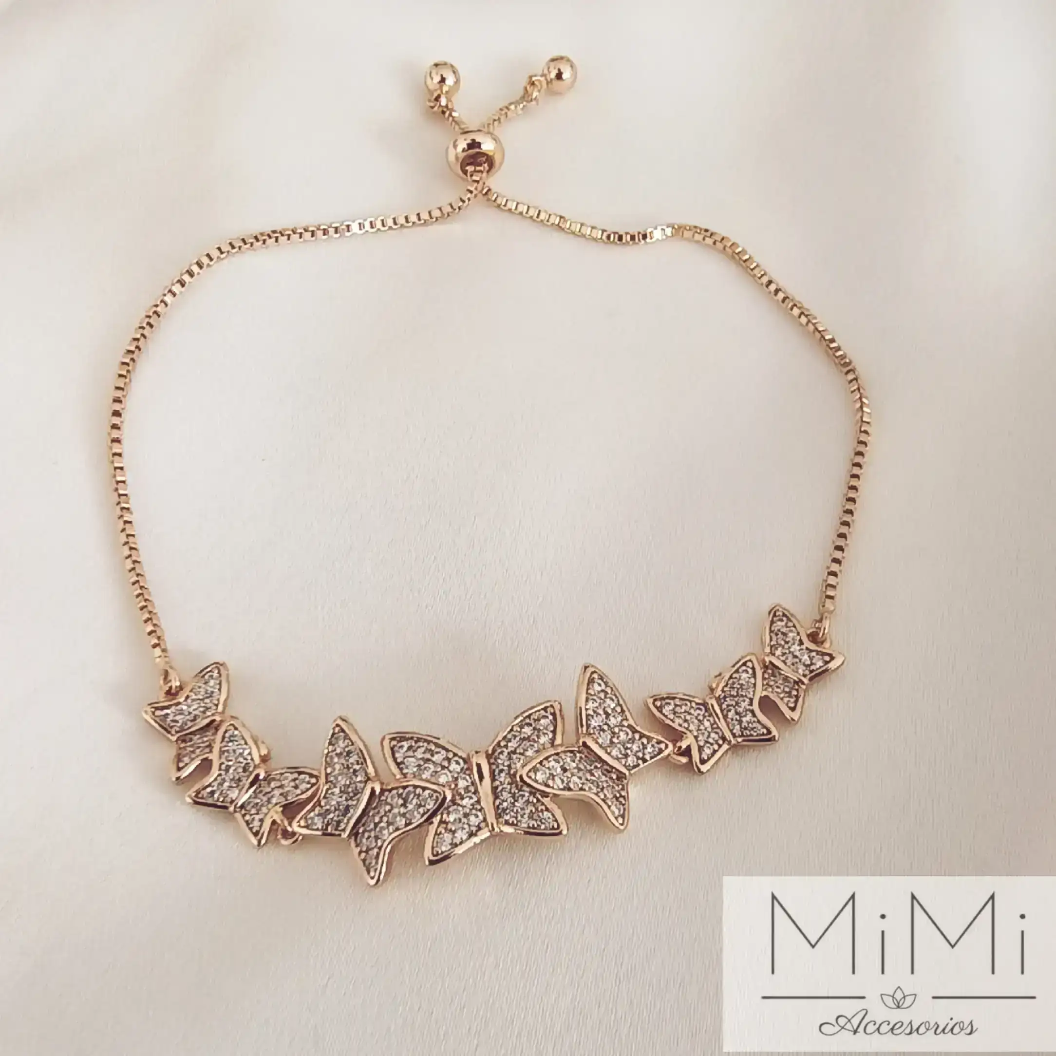 Pulsera bañada en oro con cristales Circón mariposas