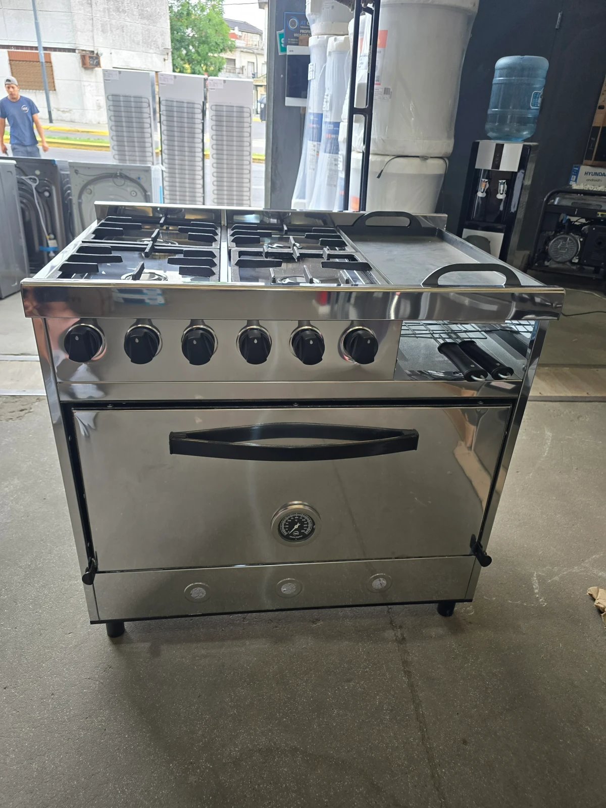 COCINA DELU 4 HORNALLAS C/PLANCHETA Y CARLITERO 86CM GAS ENVASADO