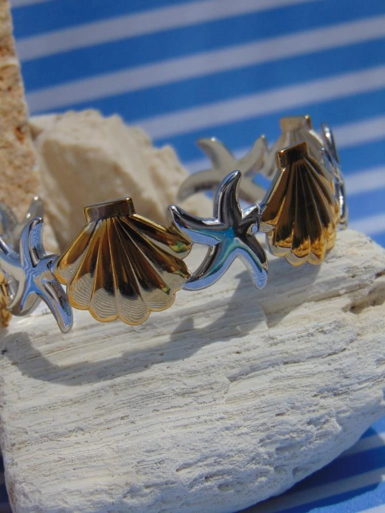BRAZALETE ACERO 2 TONOS ESTRELLAS CONCHAS