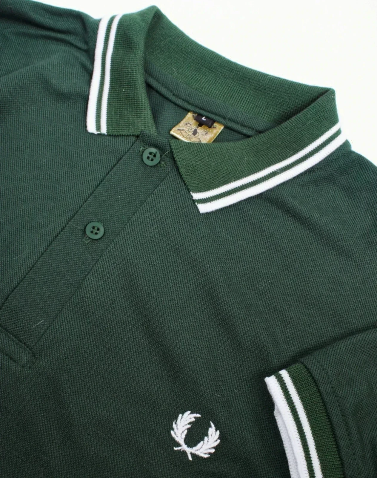 Camisa polo verde botella con blanco 