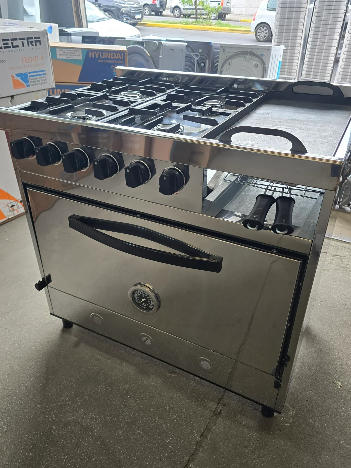COCINA DELU 4 HORNALLAS C/PLANCHETA Y CARLITERO 86CM GAS ENVASADO 4