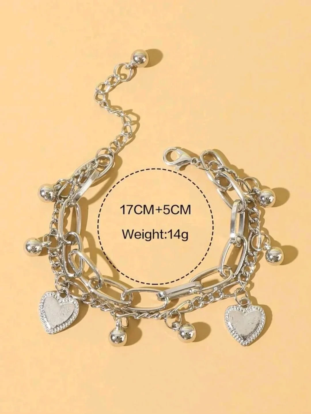 Pulsera con dijes ajustable en acero inoxidable color plata  3