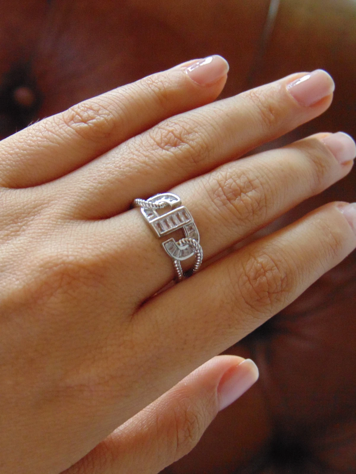 ANILLO ACERO PLATE ENTRELAZADO BAGUET